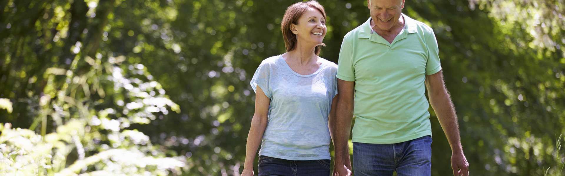 42270941 - senior couple walking in summer countryside